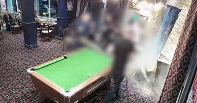 CCTV footage shows stolen car ploughing into pub inches away from people playing pool - www.manchestereveningnews.co.uk - Manchester