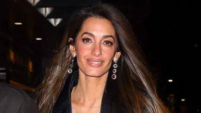 Amal Clooney Pairs Her Itty-Bitty Feathered Minidress With the Perfect Boyfriend Blazer - www.glamour.com - Britain - New York
