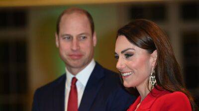 Kate Middleton Wears Bold Red Pantsuit With Plunging Neckline - www.glamour.com - Britain - county Early
