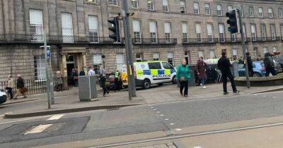 Two cops injured as man charged over alleged attack on busy Scots street - www.dailyrecord.co.uk - Scotland - Beyond