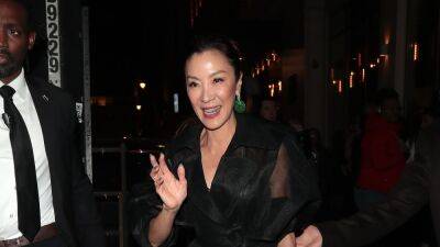 Michelle Yeoh Toughens Up a Sheer Trench With Platform Boots - www.glamour.com - London - Los Angeles - Jordan