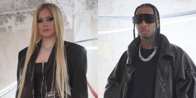 Avril Lavigne & Tyga Coordinate in Long Black Jackets at Y/Project Show as Dating Rumors Heat Up - www.justjared.com - county Long