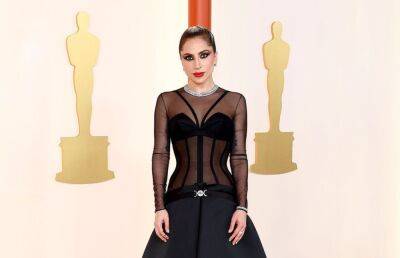 Watch Lady Gaga Help A Photographer on the Oscars Red Carpet - www.metroweekly.com