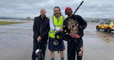 Snoop Dogg welcomed to Scotland in style as piper plays rap classic on tarmac - www.dailyrecord.co.uk - Britain - Scotland