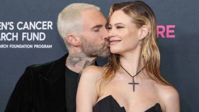 Adam Levine and Behati Prinsloo Pack on the PDA on the Red Carpet - www.etonline.com