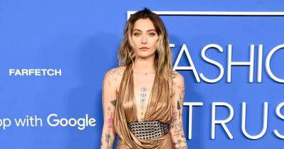 Paris Jackson shows off vast tattoo collection as she poses in plunging gold dress - www.ok.co.uk - USA - Hollywood