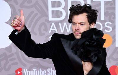 Fans react as Harry Styles uploads and deletes photo of himself in One Direction t-shirt - www.nme.com