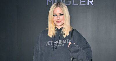 Avril Lavigne Makes Her Mark on Paris Fashion Week: From Kissing Tyga to Sitting Front Row - www.usmagazine.com - Canada