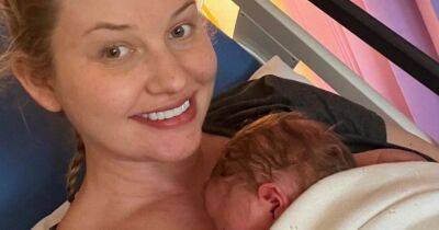 Amy Hart shares adorable new pic of baby son at home after 5 days in hospital - www.ok.co.uk