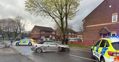 Road closed after 'car smashes into bus stop' - www.manchestereveningnews.co.uk - Manchester