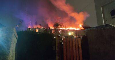 Huge blaze rips through block of Paisley flats as fire crews battle inferno overnight - www.dailyrecord.co.uk - Scotland - Beyond