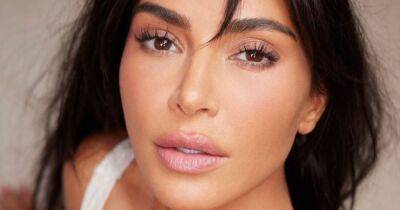 Kim Kardashian wows in new bikini pic but fans are confused over her missing fingers - www.ok.co.uk - Los Angeles - USA