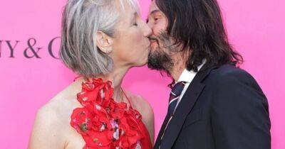 Keanu Reeves snogs girlfriend on red carpet despite 'marriage to top actor' - www.dailyrecord.co.uk - Britain - Los Angeles - Romania