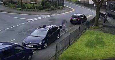 Footage shows horrifying moment man is 'struck with paving slab' as cops open murder bid probe - www.dailyrecord.co.uk - Manchester - Beyond