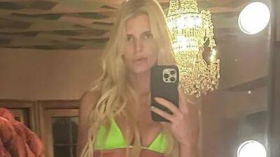 Jessica Simpson Paired a Neon SKIMS Bikini With Platforms From Her Own Collection - www.glamour.com