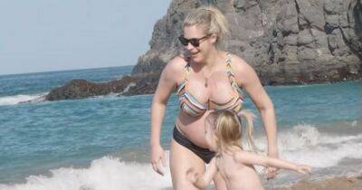 Pregnant Gemma Atkinson praised for powerful gesture for daughter Mia as she proudly shows blooming bump in bikini - www.manchestereveningnews.co.uk