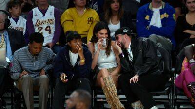Kendall Jenner and Bad Bunny Get Cozy Sitting Courtside at the Lakers Game - www.etonline.com - Los Angeles - state Golden