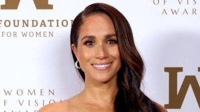 Meghan Markle Hit the Red Carpet in a Show-Stopping Gold Strapless Gown - www.glamour.com - New York