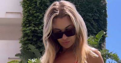 Christine McGuinness compared to Pamela Anderson in red swimsuit as she says it 'feels like a dream' - www.manchestereveningnews.co.uk - Spain - Manchester - county Anderson