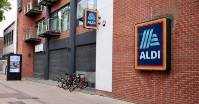 Aldi store closed off and police seen running inside as emergency services swarm supermarket - www.manchestereveningnews.co.uk - Manchester