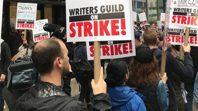WGA Members Protest With Urgent Chants, Clever Signs in NYC and L.A.: ‘No Contract, No Content’ - variety.com - New York
