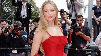 Jennifer Lawrence Wore Flip-Flops Under Her Christian Dior Gown on the Cannes Red Carpet - www.glamour.com - France - Afghanistan - city Kabul