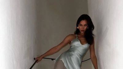 Irina Shayk Is a Bombshell in a Rare Vintage Versace Slip - www.glamour.com - France - Los Angeles