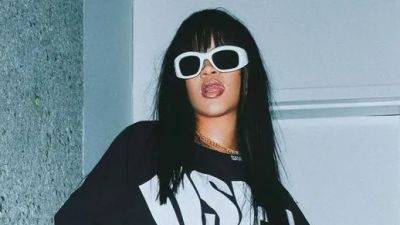 Rihanna’s Ironic Slogan Tee Is up There With the Greats - www.glamour.com - Britain