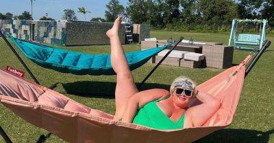 Gemma Collins does her best Victoria Beckham with iconic pose as she sunbathes in green swimsuit - www.ok.co.uk - Britain