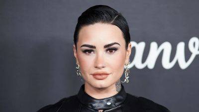 Demi Lovato Explains Why She Stopped Exclusively Using They/Them Pronouns - www.etonline.com - Britain - Spain