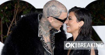 Kourtney Kardashian showcases blossoming baby bump in adorable and intimate snaps with Travis Barker - www.ok.co.uk