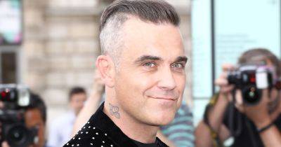 Robbie Williams forced to stop mid way through performance due to long Covid - www.ok.co.uk - Los Angeles - Netherlands - Switzerland