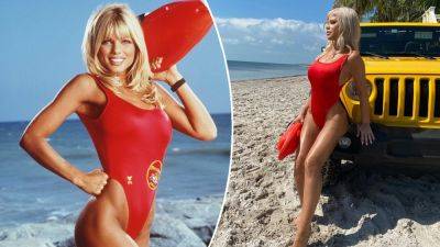 'Baywatch' star Donna D'Errico, 55, sizzles in famous red bathing suit nearly 30 years later - www.foxnews.com - Miami