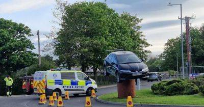 Man arrested after car found perched on roundabout in Scots town - www.dailyrecord.co.uk - Scotland - USA - Beyond