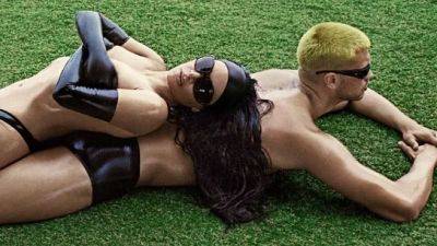 Topless Kim Kardashian Uses a Male Model as Lawn Chair in New Swim Campaign - www.glamour.com
