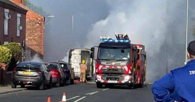Huge plumes of black smoke seen with main road shut after van fire - www.manchestereveningnews.co.uk - Manchester