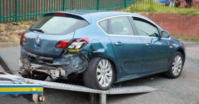 Car left smashed after driver 'reverses into police van' as road cordoned off - www.manchestereveningnews.co.uk - Manchester - county Oldham - city Oldham