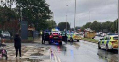 Road taped off as man rushed to hospital after crash between car and bike - www.manchestereveningnews.co.uk - Manchester