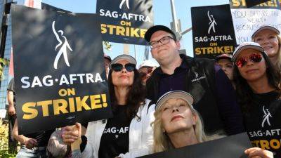 How the 2023 SAG-AFTRA Strike Is Affecting Hollywood: From Delayed Releases to Empty Sets - www.etonline.com - Hollywood - county Lawrence