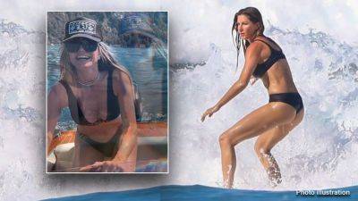 Gisele surfs in bikini, and Heidi Klum flashes her abs aboard yacht as stars heat up July 4th holiday weekend - www.foxnews.com - Brazil - Italy - Costa Rica