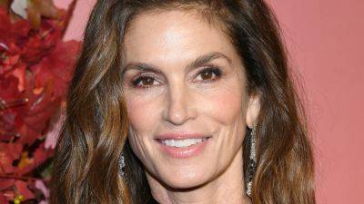 Cindy Crawford Goes Topless for a Quick Dip in Nature - www.glamour.com