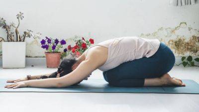 7 Yoga Poses for Beginners That Will Transform Your Body and Your Mind - www.glamour.com