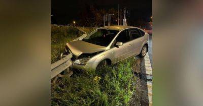 Wrecked car seized by police after being ploughed into metal barrier by suspected drink driver - www.manchestereveningnews.co.uk