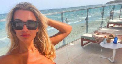 Christine McGuinness 'had enough' as she's told 'I can't even look' after flaunting golden tan and toned abs on solo getaway - www.manchestereveningnews.co.uk - Britain
