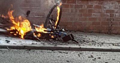 Electric bike bursts into flames outside house as fire crews close off road - www.manchestereveningnews.co.uk - Manchester