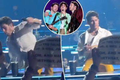 Nick Jonas falls through a hole on stage during ‘The Tour’ show: ‘Ouch’ - nypost.com - New York - Boston