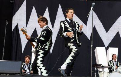 Watch The Hives join band covering them in the street outside Liverpool signing session - www.nme.com - Sweden