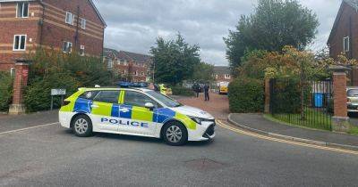 Three in hospital injured after police called to 'disturbance' on estate - www.manchestereveningnews.co.uk - Manchester