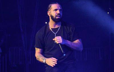 Drake hits out at fan for throwing book at his head onstage - www.nme.com - London - Los Angeles - New York - San Francisco - city Vienna