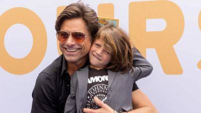 John Stamos Celebrates 60th Birthday Cuddled Up to Son Billy: 'Right Where I'm Supposed to Be' - www.etonline.com